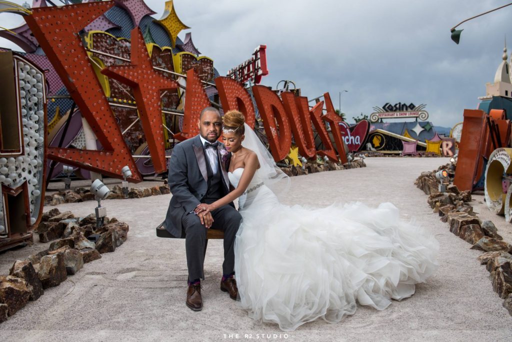 the neon museum in las vegas wedding photos by the best las vegas wedding photographers, The R2 Studio. These are also called wedding photos at the boneyard in las vegas.